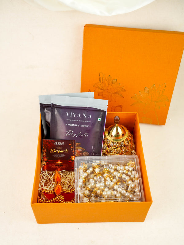 Deepavali: Box with Beads Thoran, Rangoli Diya, Crystal Diya & Dry Fruits - WDC0028