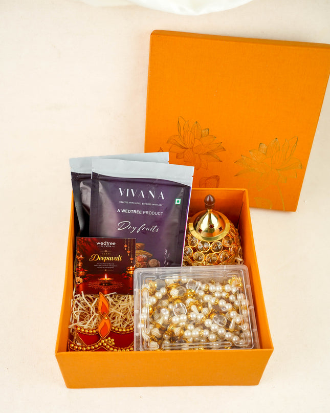 Deepavali: Box with Beads Thoran, Rangoli Diya, Crystal Diya & Dry Fruits - WDC0028