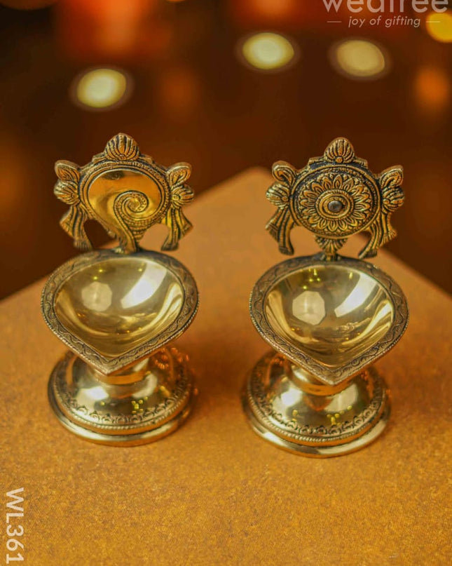 Brass Shanku Chakra Diya With Stand - Set Of 2 Wl3611