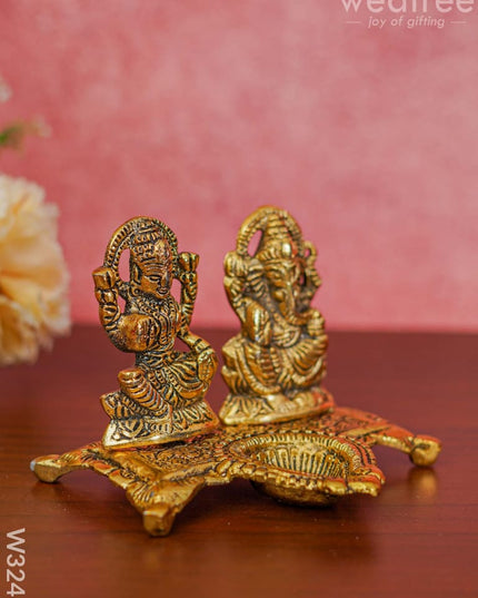 White Metal Gold Lakshmi Ganesha With Diya Divine Figurines