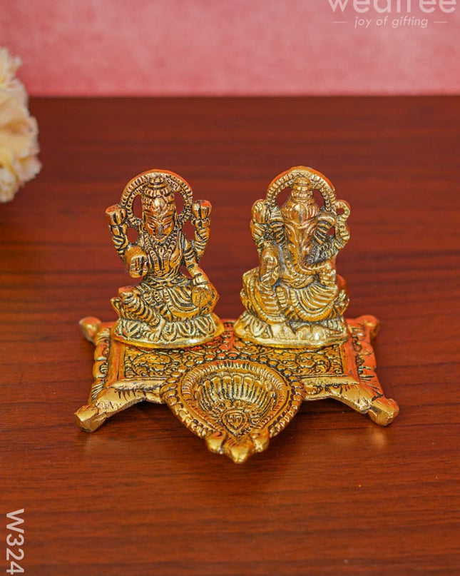 White Metal Gold Lakshmi Ganesha With Diya Divine Figurines