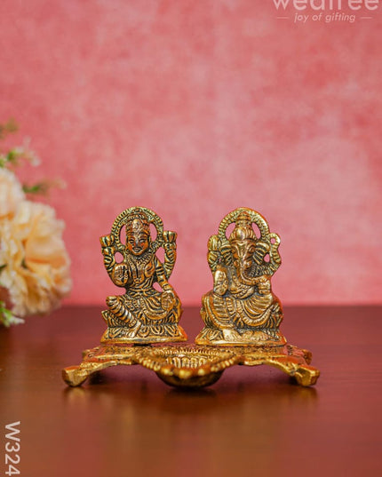 White Metal Gold Lakshmi Ganesha With Diya Divine Figurines