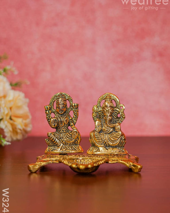 White Metal Gold Lakshmi Ganesha With Diya Divine Figurines