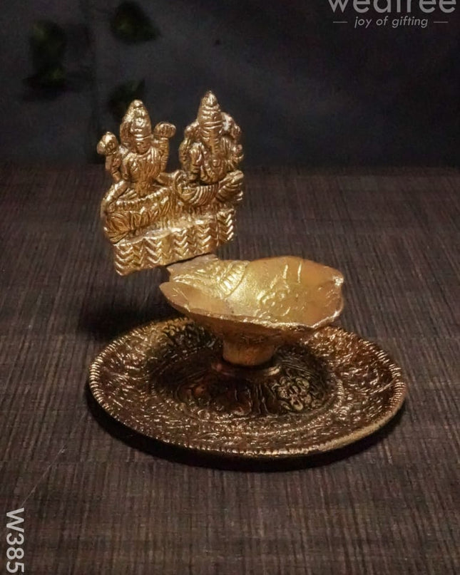 White Metal Oxidised Lakshmi Ganesh Hand Diya Gold Finish - W3858 Diyas