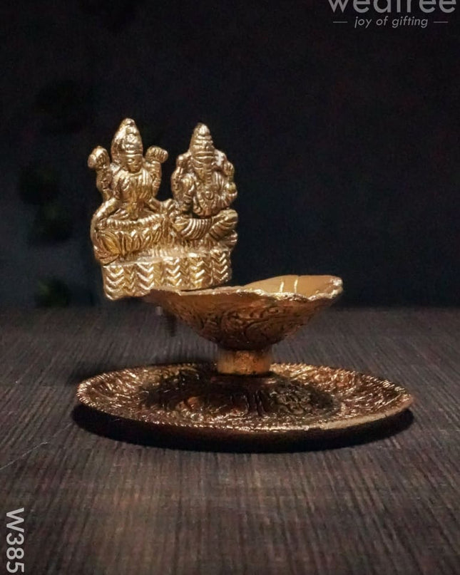 White Metal Oxidised Lakshmi Ganesh Hand Diya Gold Finish - W3858 Diyas