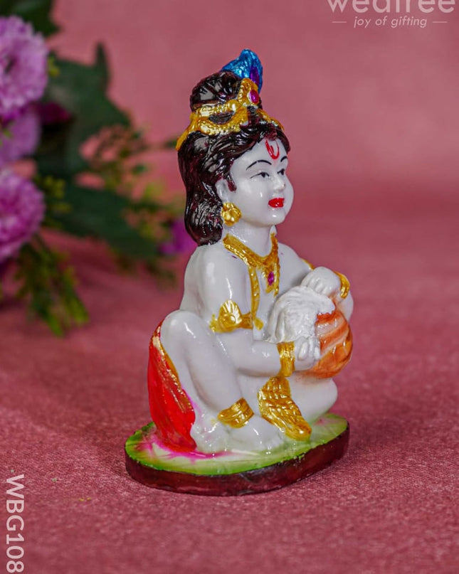 Polyresin Butter Krishna Idol - Wbg1086 Home Decors